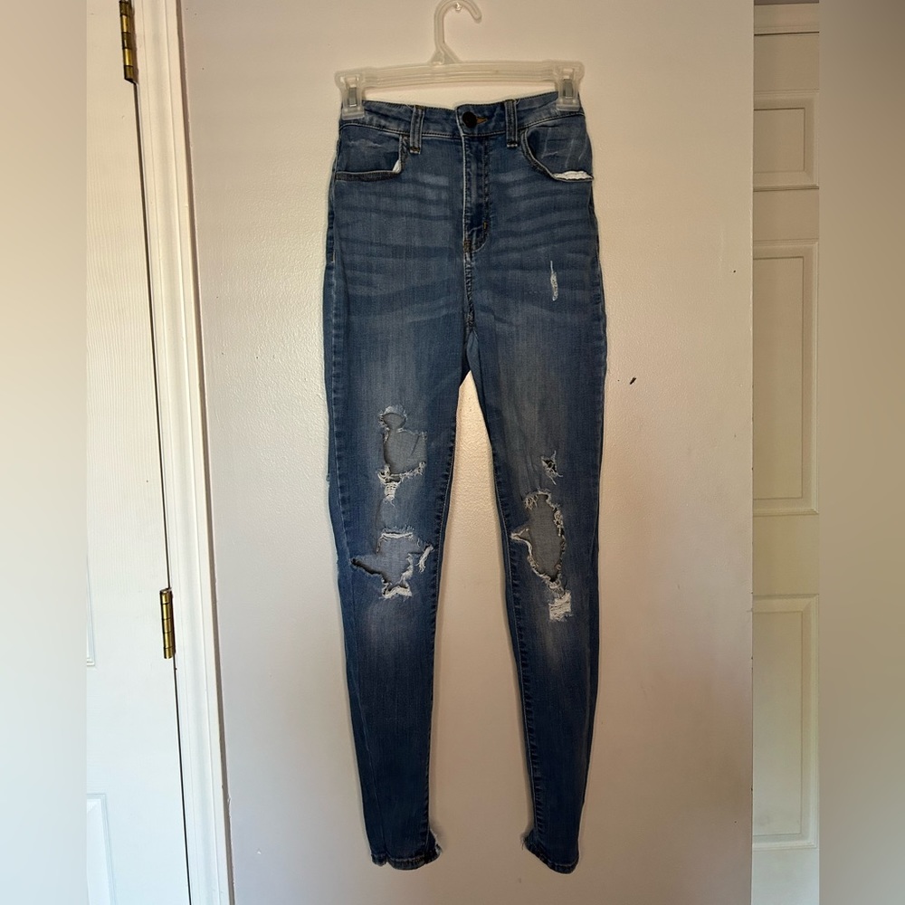 Ripped skinny jeggings and rips on back pocket.